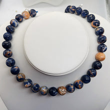 Load image into Gallery viewer, Blue Sodalite with White and Orange 12mm Round Bead Strand 110781