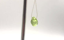 Load and play video in Gallery viewer, Peridot Faceted Briolette Bead | .9 cts | 7x5x3mm | Green | 1 bead |
