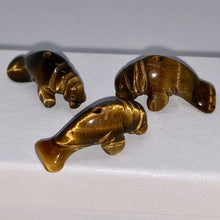 Load image into Gallery viewer, Tiger Eye Carved Manatee Beads | 21x11x9mm | Golden brown - PremiumBead Alternate Image 2