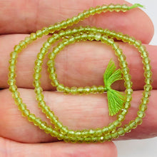 Load image into Gallery viewer, Peridot Faceted Roundel 13" Bead Strand | 4 mm | Green | 130 Beads | 13" |