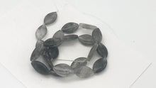 Load and play video in Gallery viewer, Misty Grey Tourmalated Quartz Bead Strand | 20mm | Grey | Flat Oval | 21 Beads |