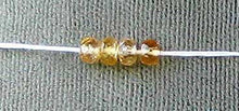 Load image into Gallery viewer, Natural 3.75x2.5mm Imperial Topaz Faceted Roundel Bead 54cts. Strand 106187 - PremiumBead Alternate Image 3