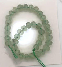 Load and play video in Gallery viewer, Rare Gemmy Prehnite Faceted Half-Strand | 6x5 or 4mm | Green | Roundel | 36 bds|
