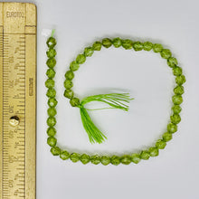 Load image into Gallery viewer, Peridot Faceted Half-Strand Round Beads | 7x4mm | Green | 47 Beads |