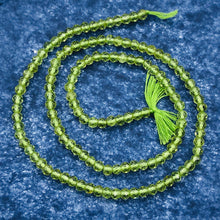 Load image into Gallery viewer, Peridot Faceted Roundel 13" Bead Strand | 4 mm | Green | 130 Beads | 13" |