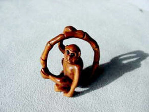 Swingin Carved & Signed Boxwood Monkey Ojime/Netsuke Bead | 22x21x11m | Brown - PremiumBead Primary Image 1