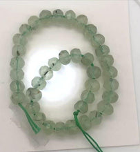 Load and play video in Gallery viewer, Rare Gemmy Prehnite Faceted Strand | 6x5 to 6x4mm | Green | Roundel | 78 bds |
