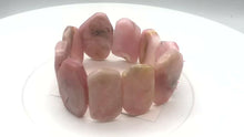 Load and play video in Gallery viewer, Pin Cushion Faceted Peruvian Opal Stretchy Bracelet | 7&quot; | Pink | 9 beads |
