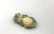 Load and play video in Gallery viewer, Waterbuffalo Bone Frog | 28x15x7mm | Green/Cream | 1 Bead
