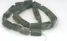 Load and play video in Gallery viewer, Natural graduated Rutilated Quartz strand | 20x11x6 - 15x8x5 | Green| Rectangle|
