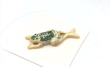 Load and play video in Gallery viewer, Waterbuffalo Bone Leeping Frog | 54x20x9mm | Cream/Green/Black | 1 Bead |
