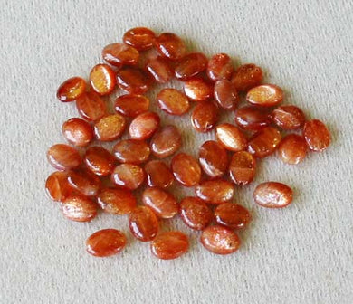 5 Spectacular 7x6x3 to 10x6x3mm Orange Sunstone Oval Beads 3588 - PremiumBead Primary Image 1