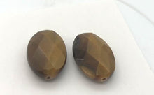 Load and play video in Gallery viewer, Exotic Perfectly Faceted Tigereye Beads| 24x15x7 | Golden | Oval | 2 beads |
