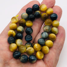 Load image into Gallery viewer, HawkeyeTigereye 16&quot; Strand Round | 10 mm | Blue/Golden Brown | 38 Beads |
